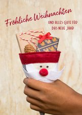 FairTrade-Weihnachtskarte mit Hand und Geschenken