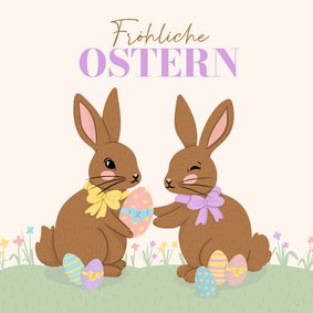 Ostergrußkarte Osterhasen mit Schleife und Ostereiern