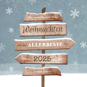 Weihnachtskarte Wegweiser und Schneeflocken