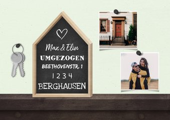 Umzugskarte mit Haus, Fotos und Schlüsseln