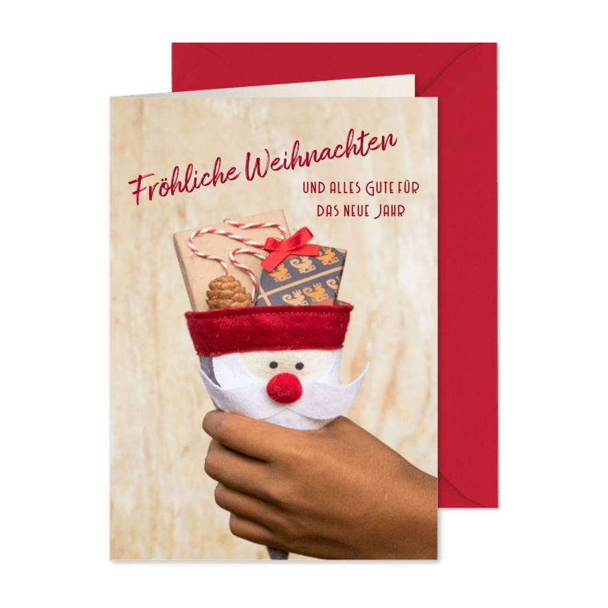 FairTrade-Weihnachtskarte mit Hand und Geschenken - Karteneindruck