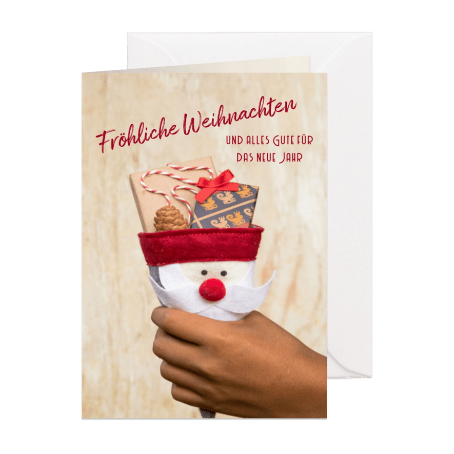 FairTrade-Weihnachtskarte mit Hand und Geschenken - Karteneindruck
